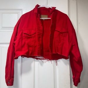 Red cropped distressed jean jacket.